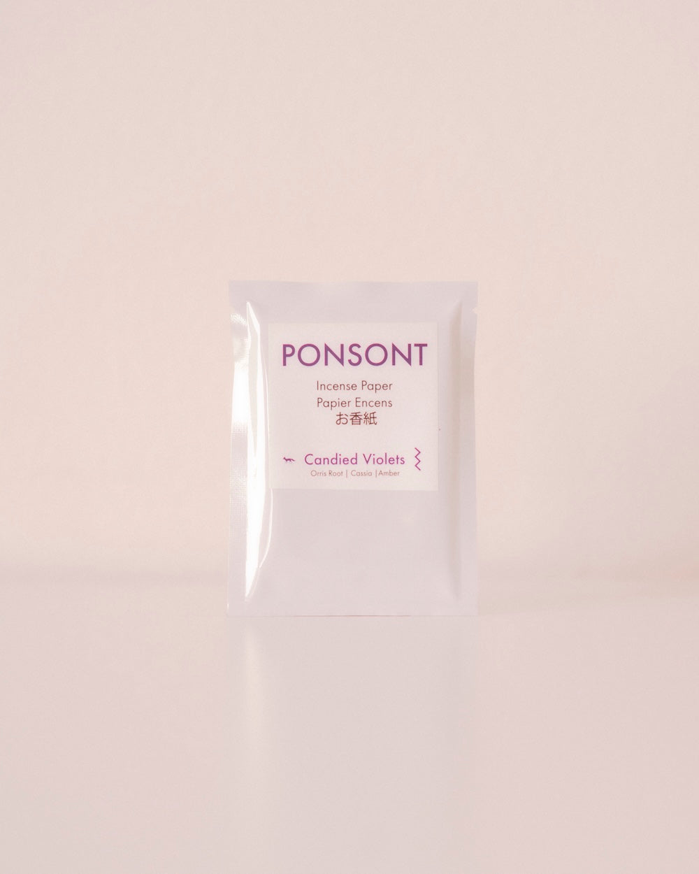 Ponsont Candied Violets incense paper packet with minimalist white and purple design, featuring notes of orris root, cassia, and amber.