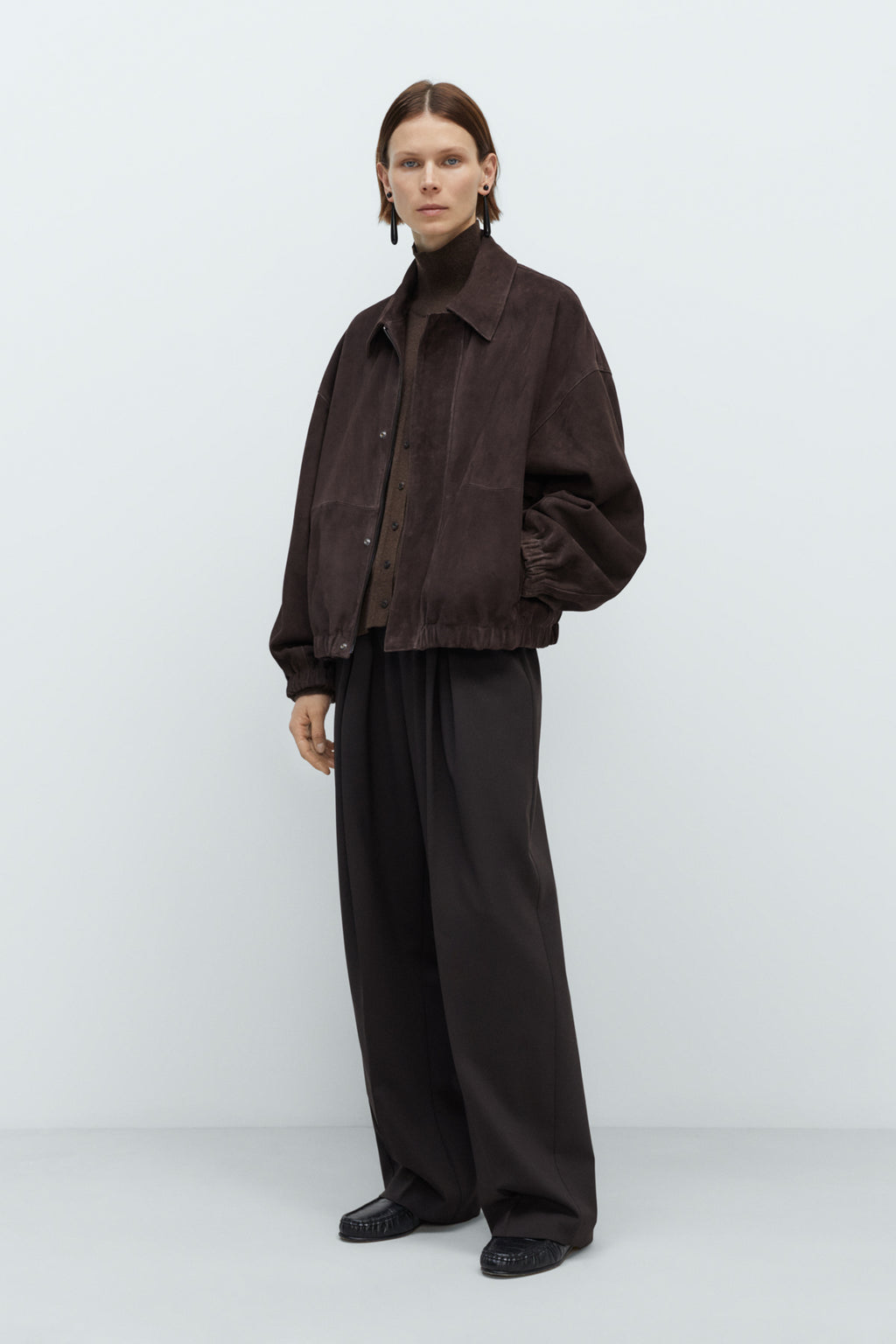 Model wearing CORDERA FW25 Bomber Jacket in Brown Suede