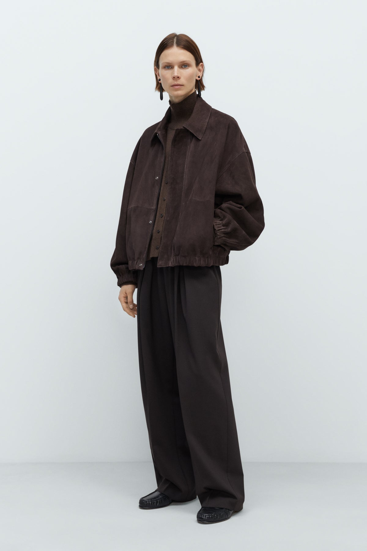 Model wearing CORDERA FW25 Bomber Jacket in Brown Suede