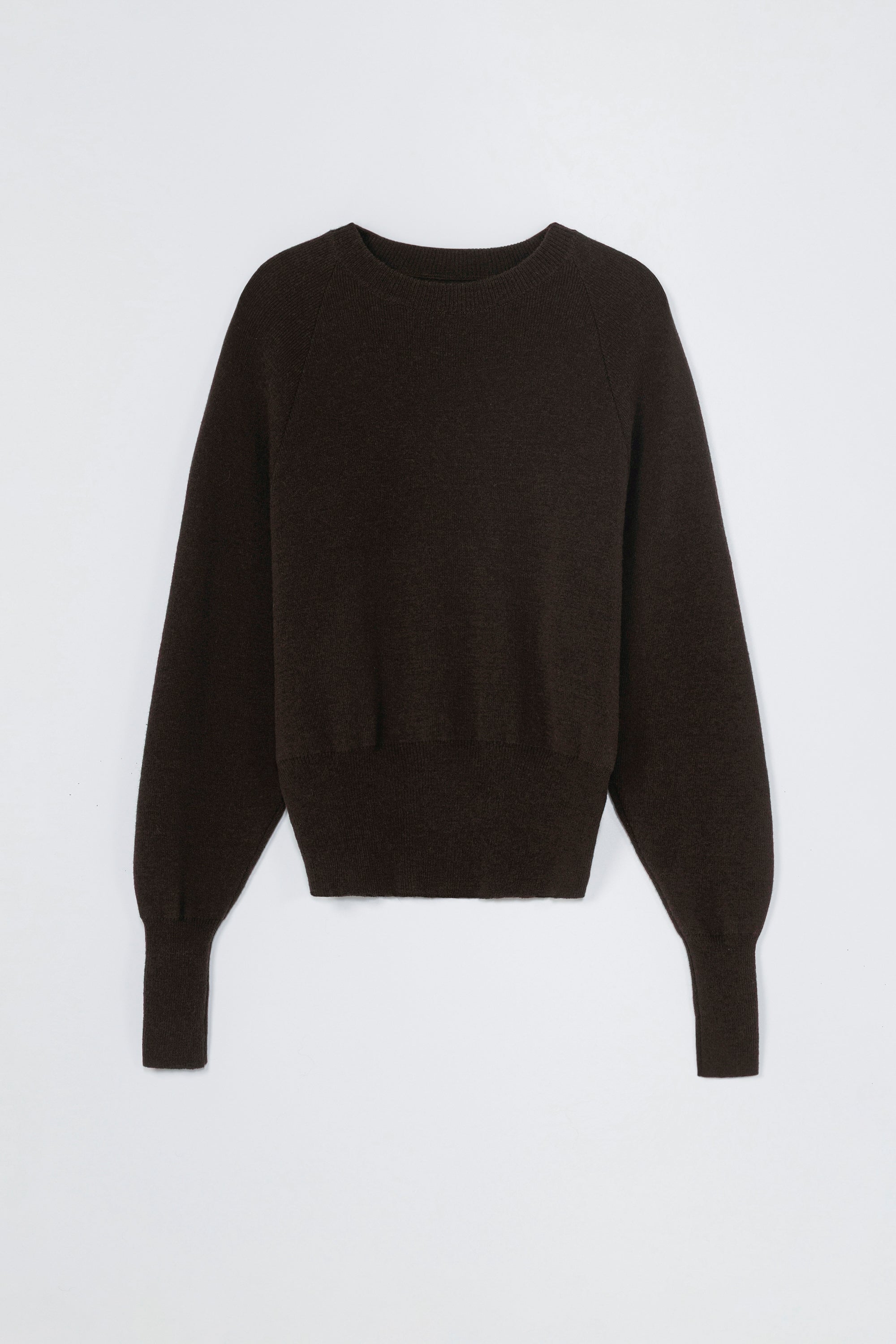 Black cashmere sweater on a light gray background