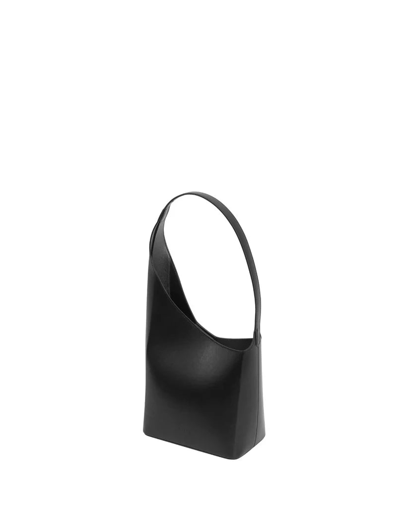 Black handbag with a strap on a white background