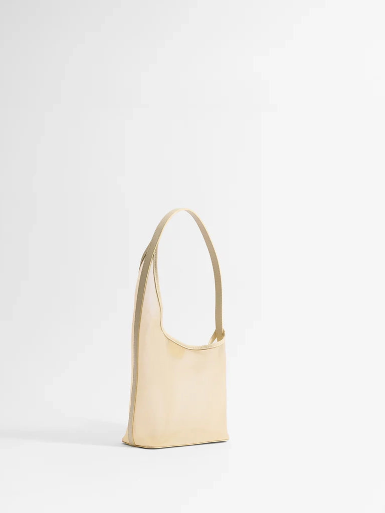 Beige handbag on a white background