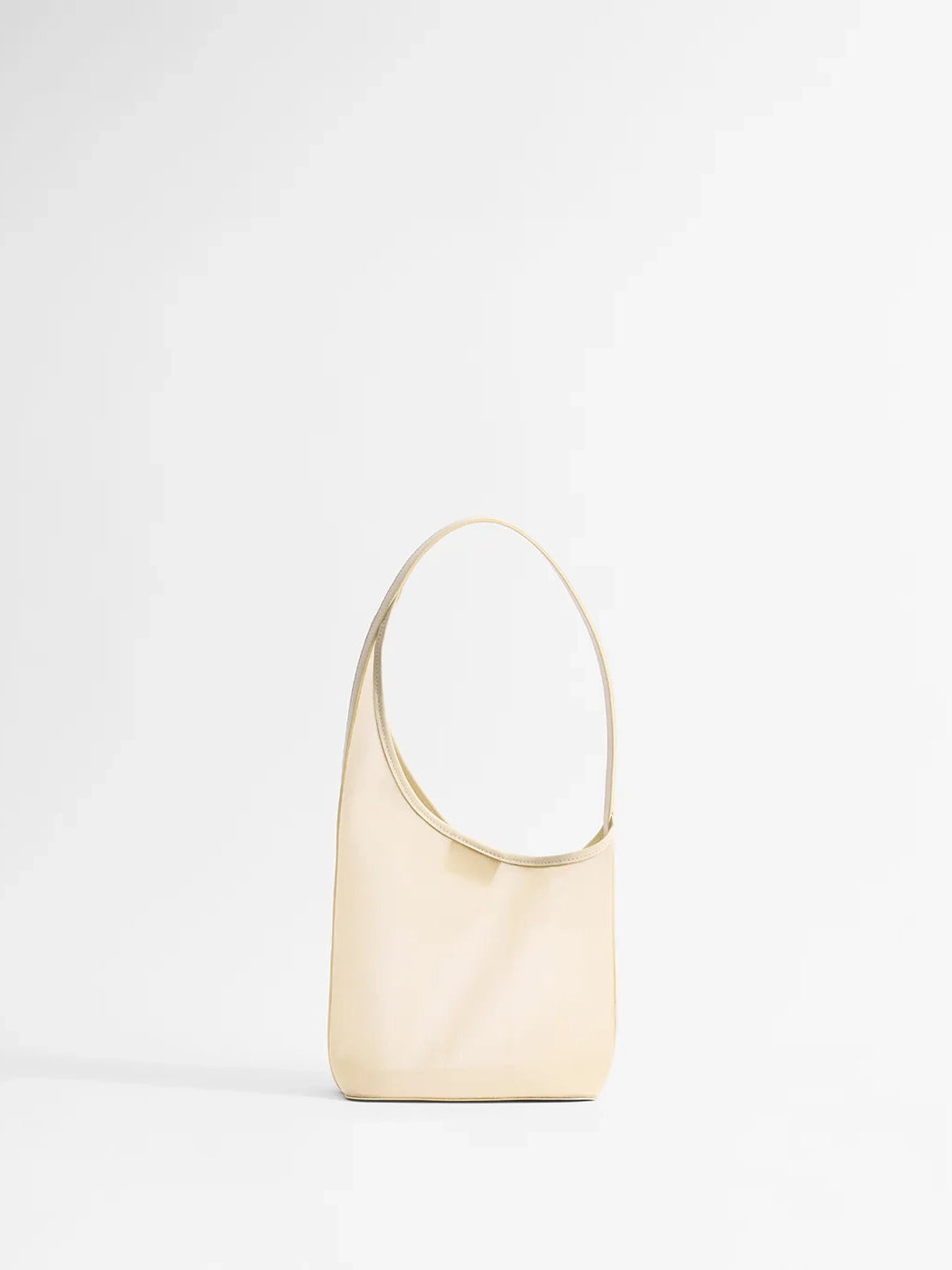 Beige handbag on a light gray background
