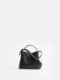 Aesther Ekme Mini Sac in vintage black calfskin with a structured silhouette, top handle and adjustable crossbody strap.