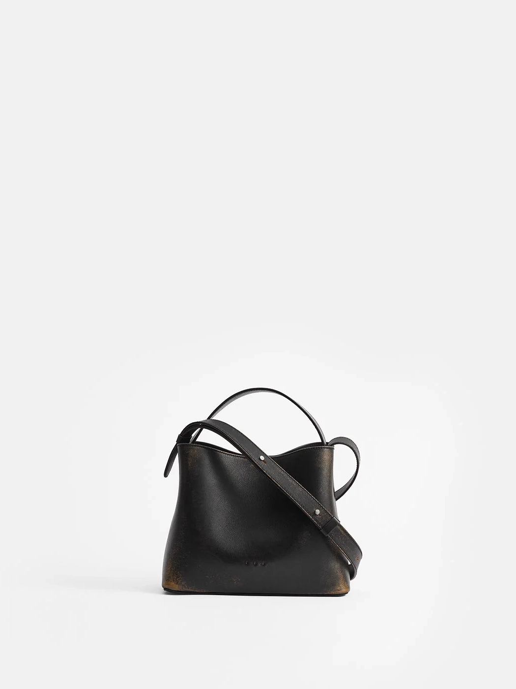 Aesther Ekme Mini Sac in vintage black calfskin with a structured silhouette, top handle and adjustable crossbody strap.