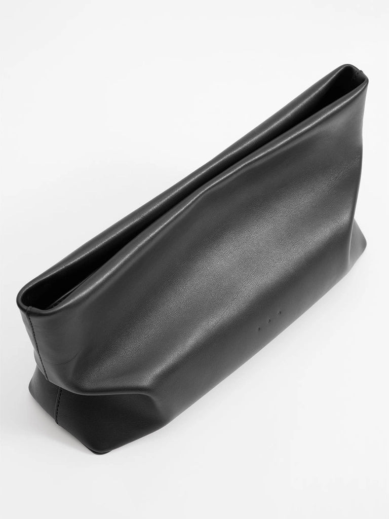 Black leather clutch bag on a white background