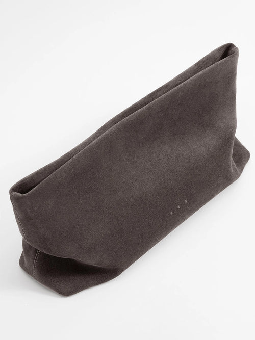 Aesther Ekme Nina Clutch in dark suede taupe with a draped, softly structured silhouette and detachable strap.