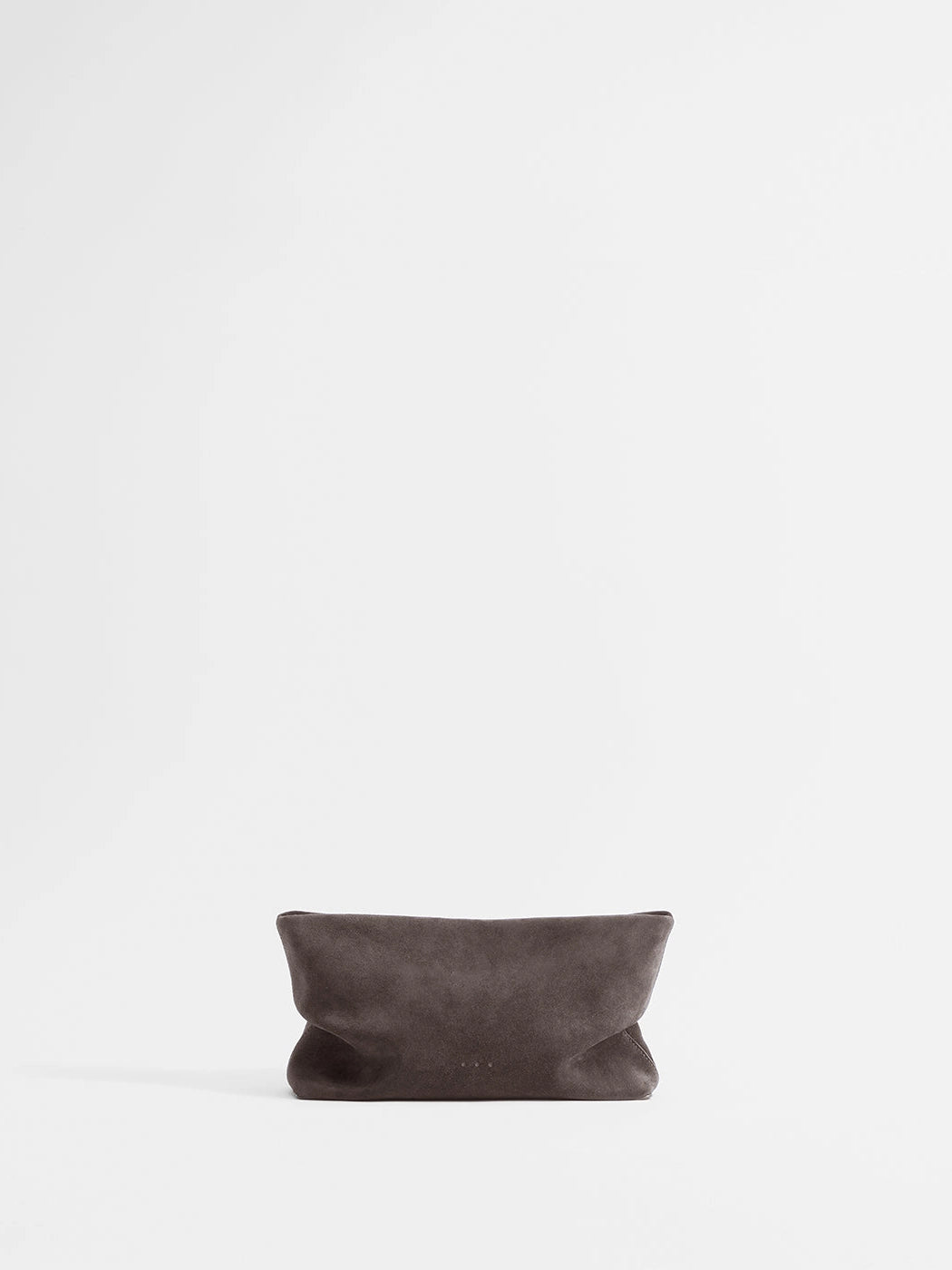 Aesther Ekme Nina Clutch in dark suede taupe with a draped, softly structured silhouette and detachable strap.