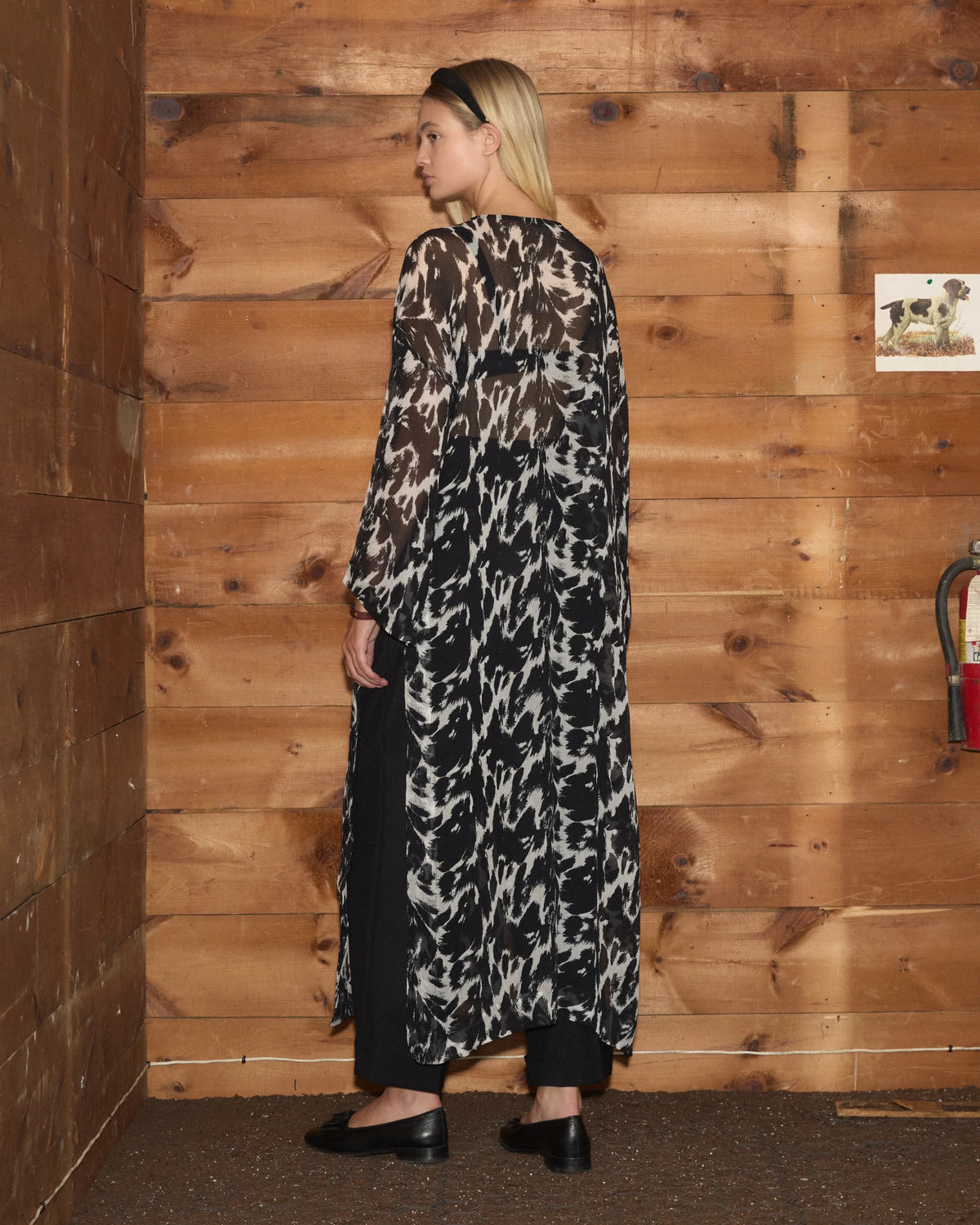 Bode Appaloosa Kaftan in black and white textured silk crepe with an all-over spotted print and black frog closures.