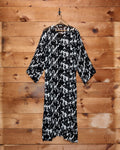 Bode Appaloosa Kaftan in black and white textured silk crepe with an all-over spotted print and black frog closures.