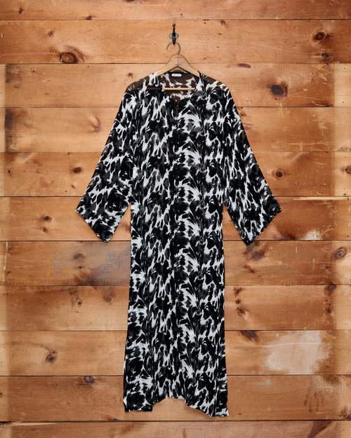 Bode Appaloosa Kaftan in black and white textured silk crepe with an all-over spotted print and black frog closures.