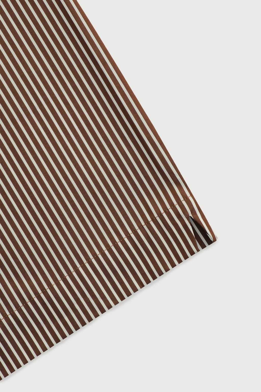 Brown striped fabric on a white background