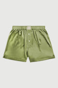 Green shorts on a light gray background