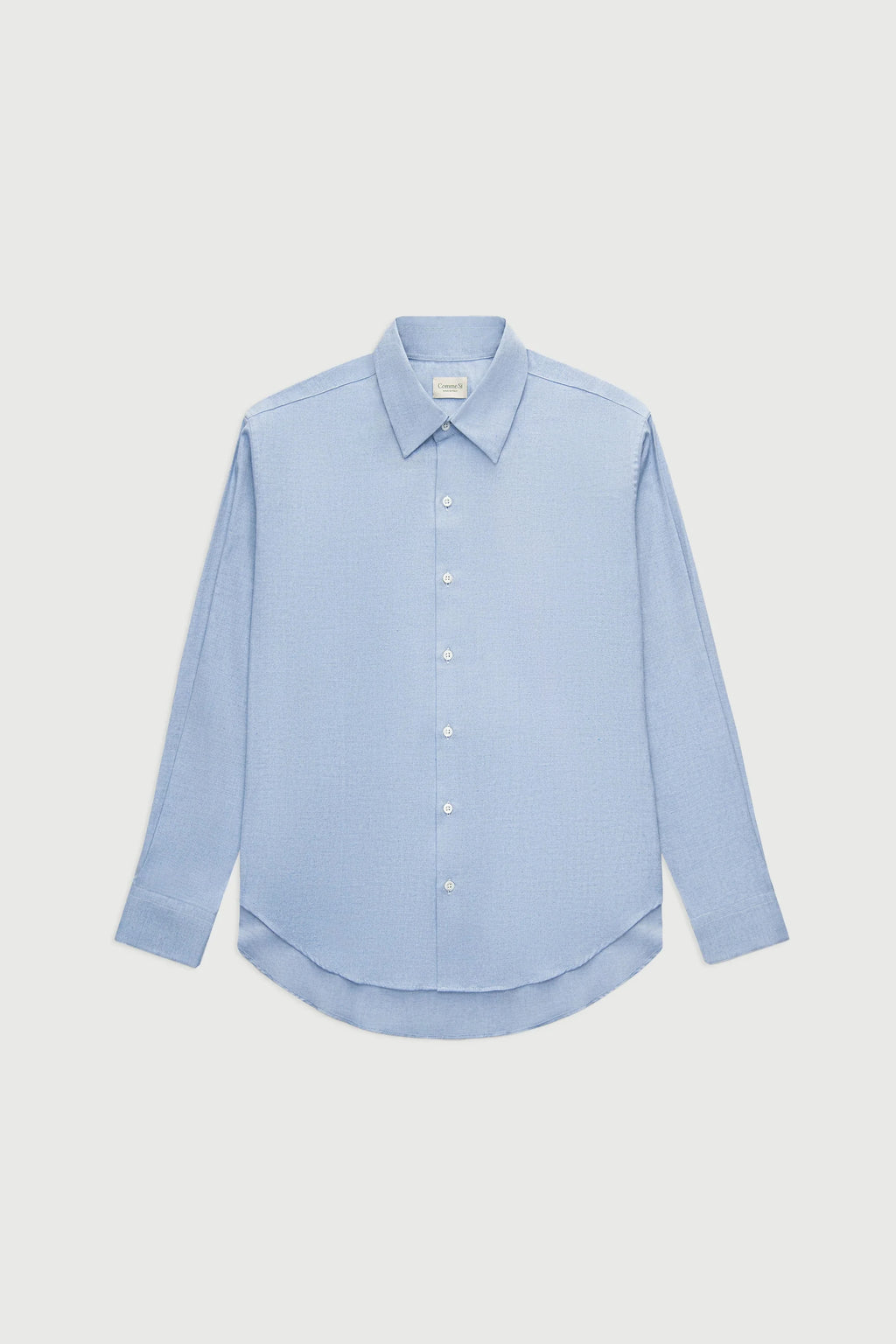 Light blue shirt on a light gray background