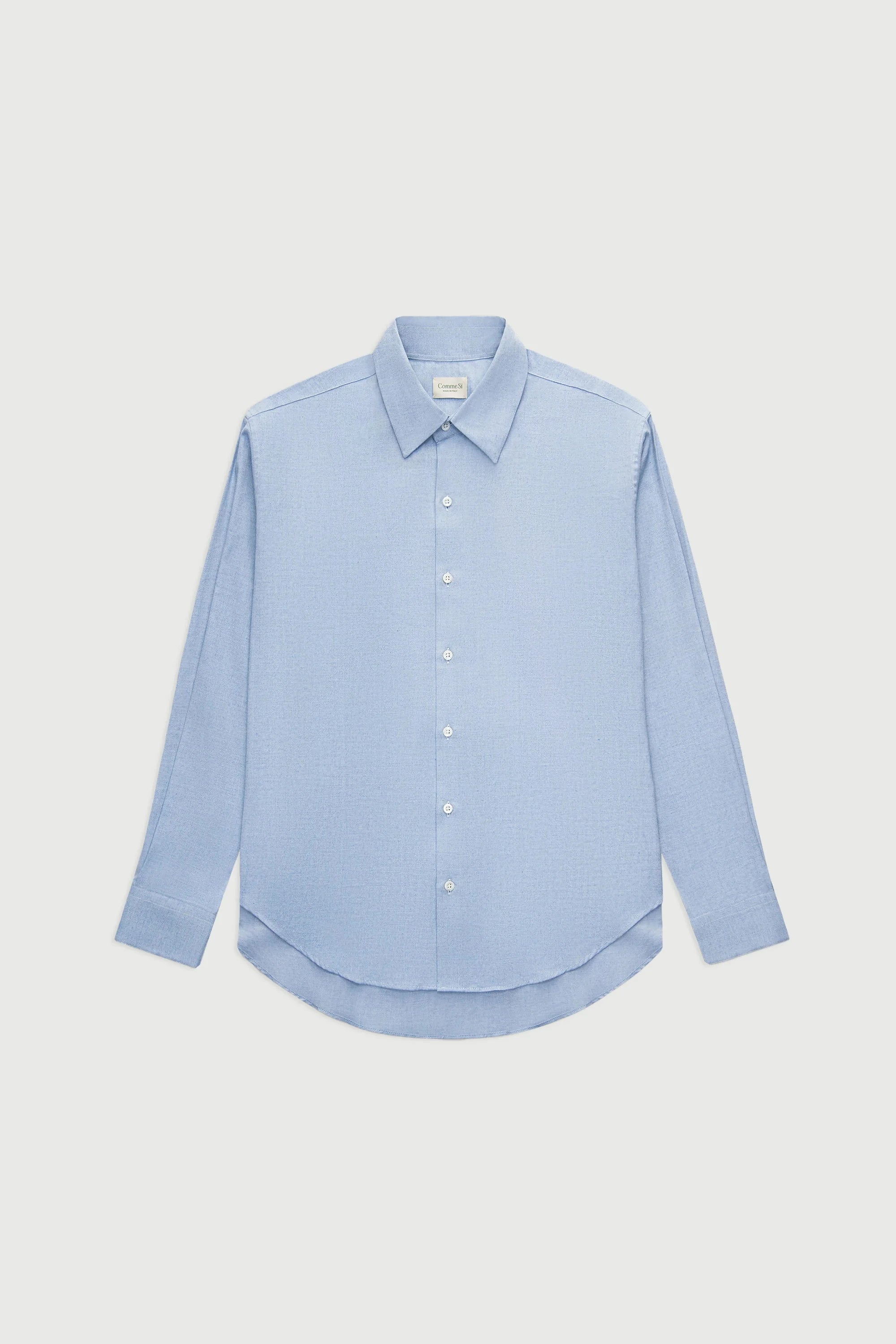 Light blue shirt on a light gray background