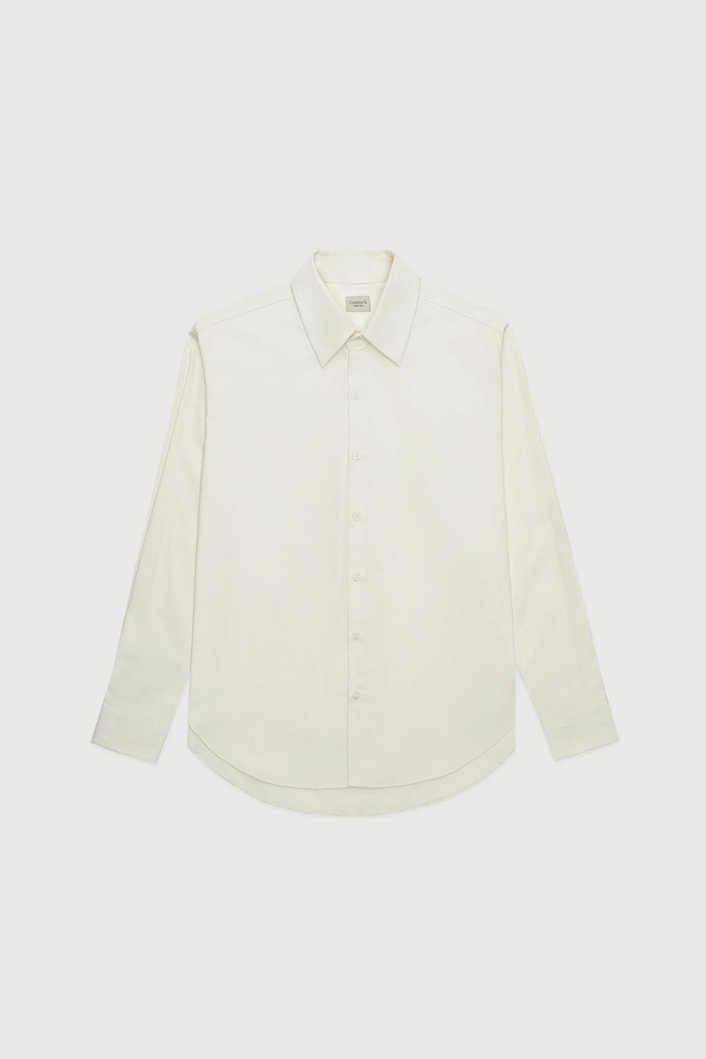 White shirt on a light beige background