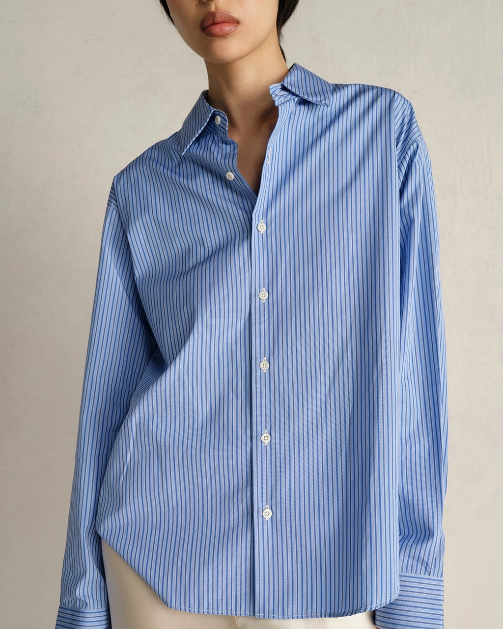 Model wearing Comme Si La Shirt Classica in Celeste Stripe