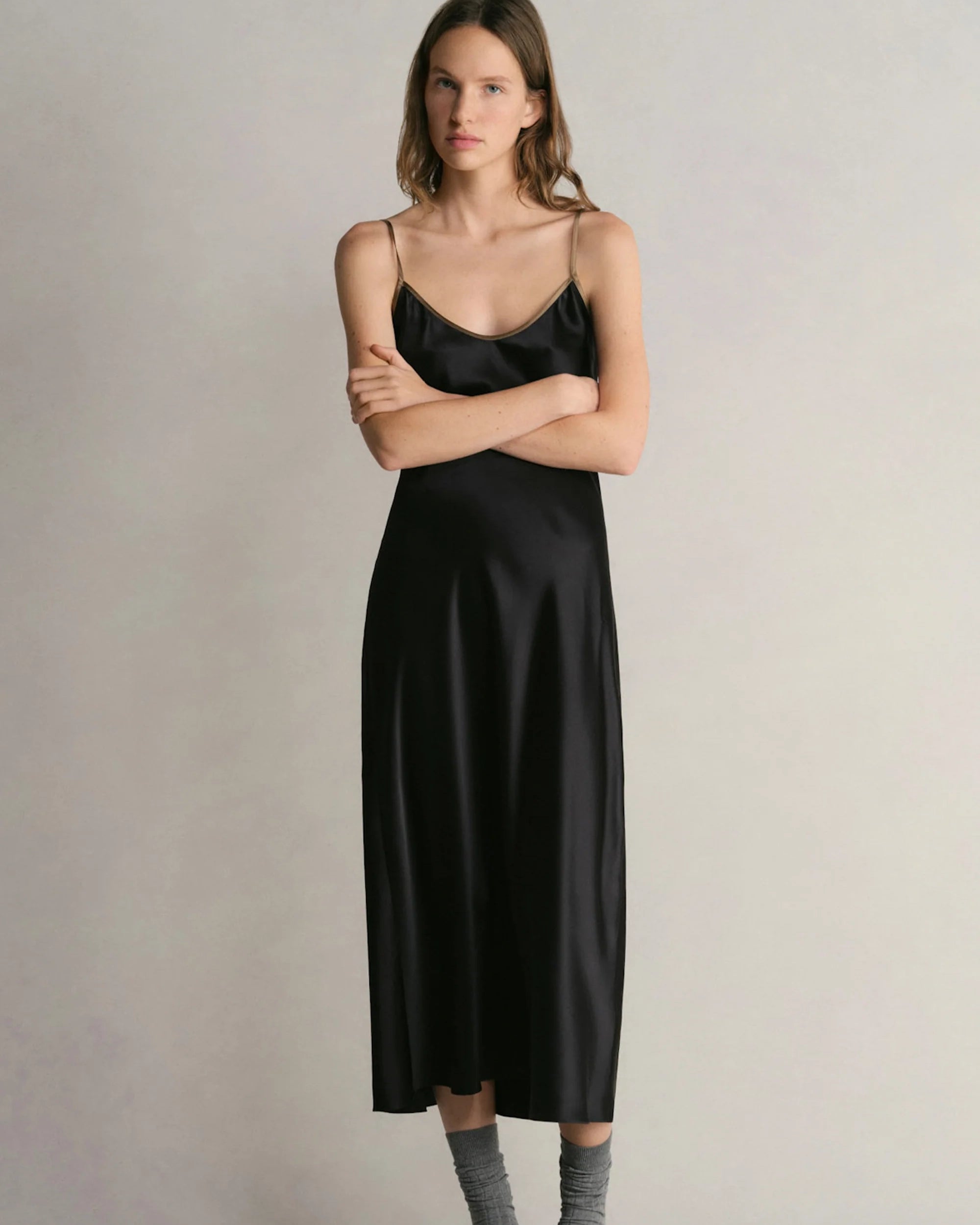 Model wearing Comme Si Silk Bias Slip Dress in Black