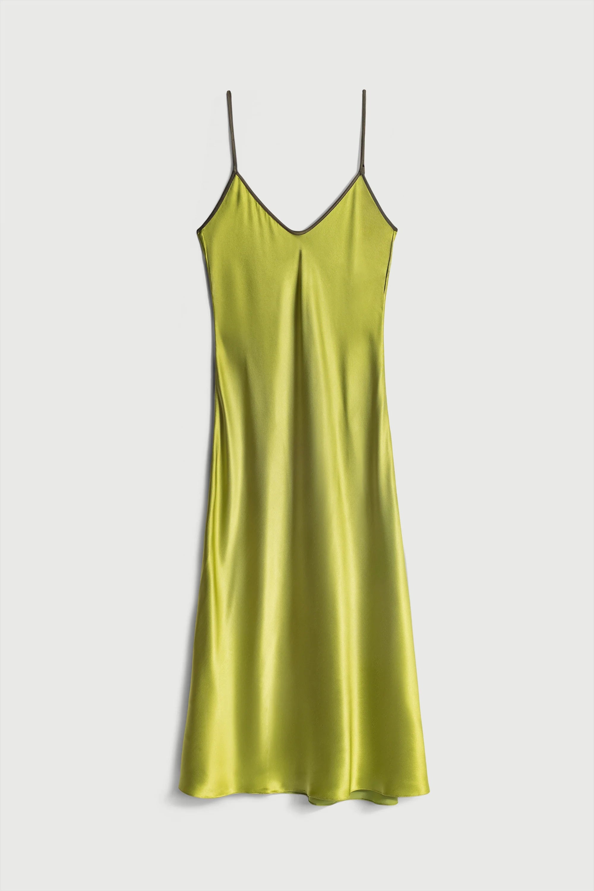 Yellow slip dress on a white background