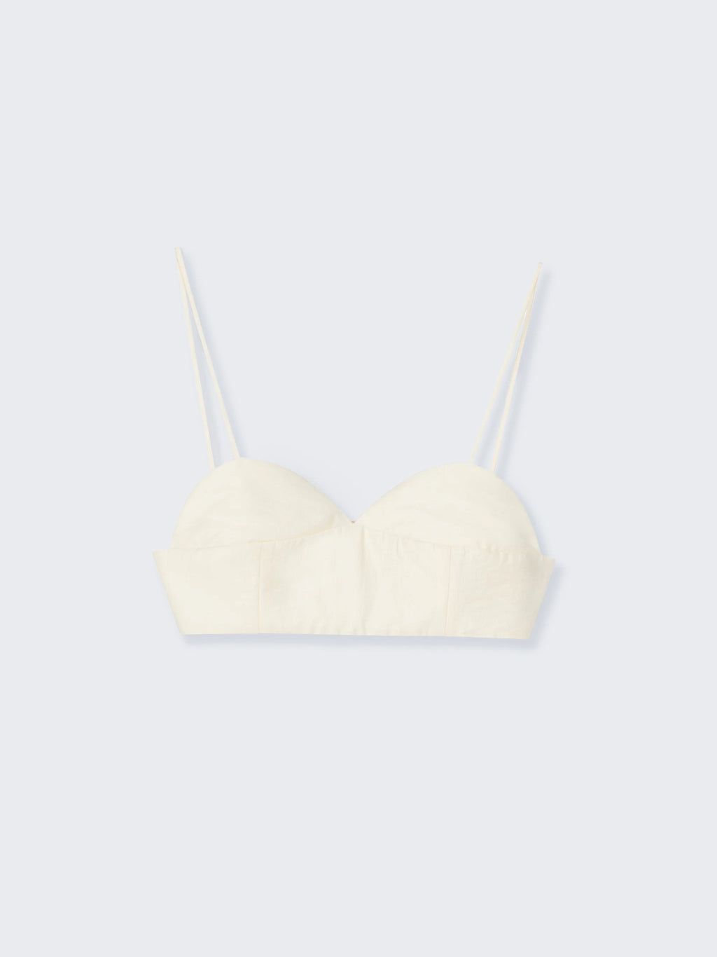 Cream-colored bralette on a light gray background