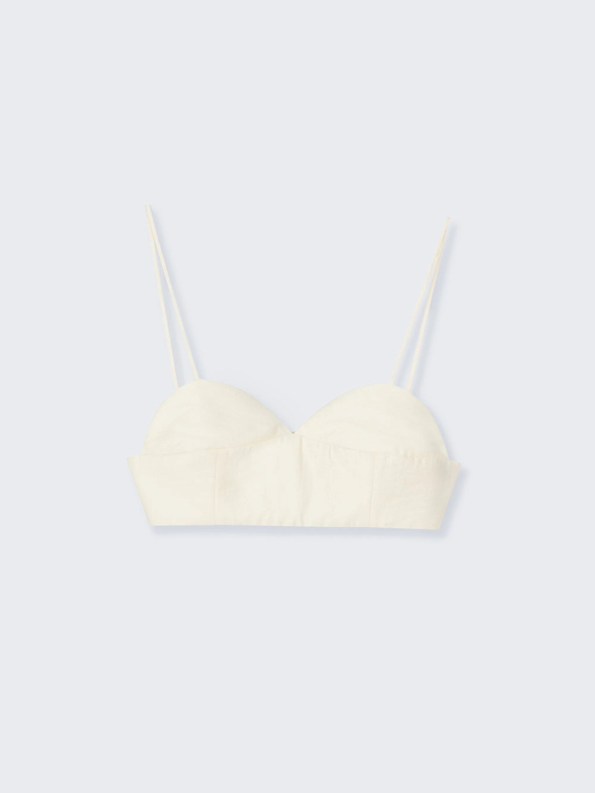 Cream-colored bralette on a light gray background