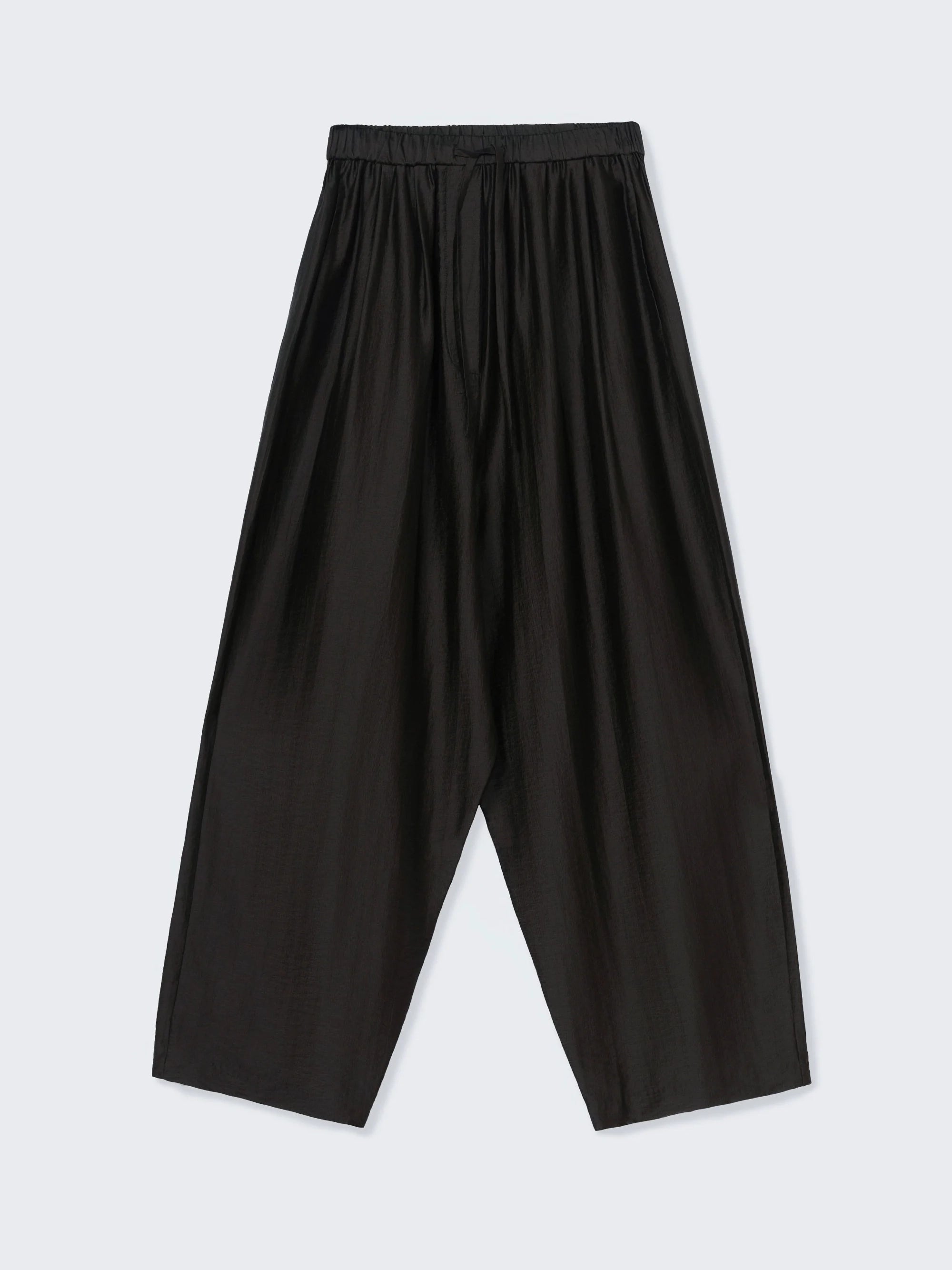 Black wide-leg pants on a light gray background