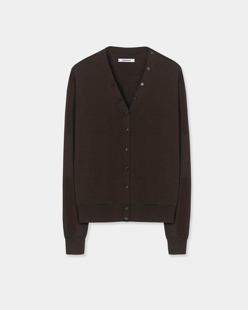 CORDERA Merino Wool Button Cardigan in brown with a V-neckline and decorative buttons extending along the neckline.