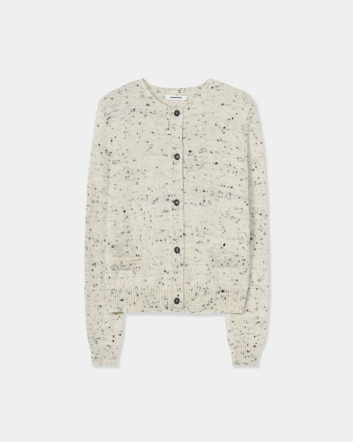 CORDERA Merino Wool Flecked Cardigan in natural with a flecked chunky knit, button front and patch pockets.