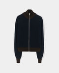 CORDERA Merino Wool Sporty Cardigan in navy with white sleeve stripes, brown ribbed trim and a front zip closure.