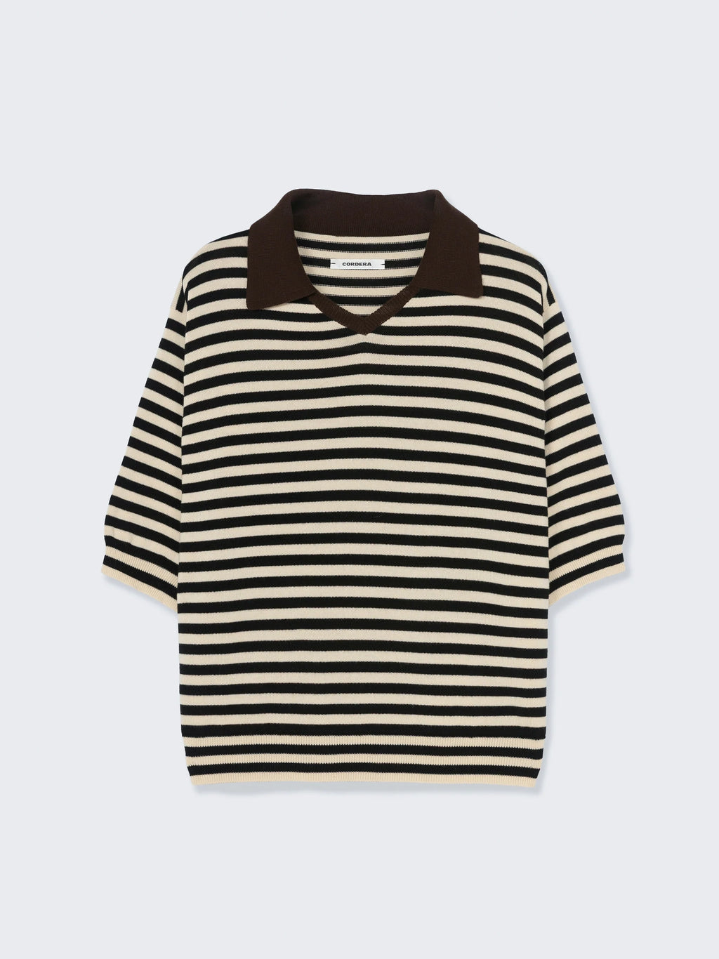 Black and white striped sweater with brown collar on a light gray background