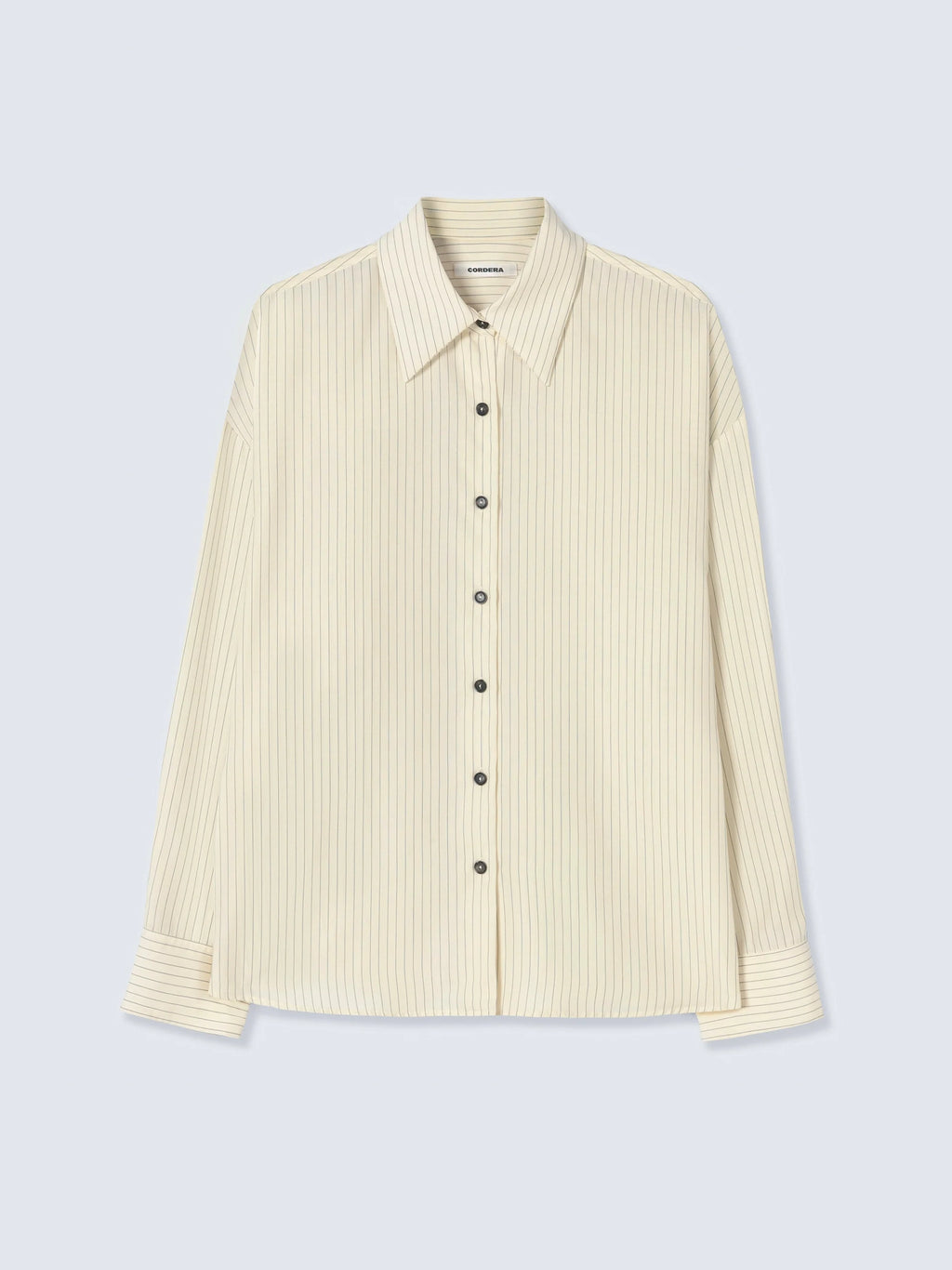 Beige ribbed shirt on a light gray background