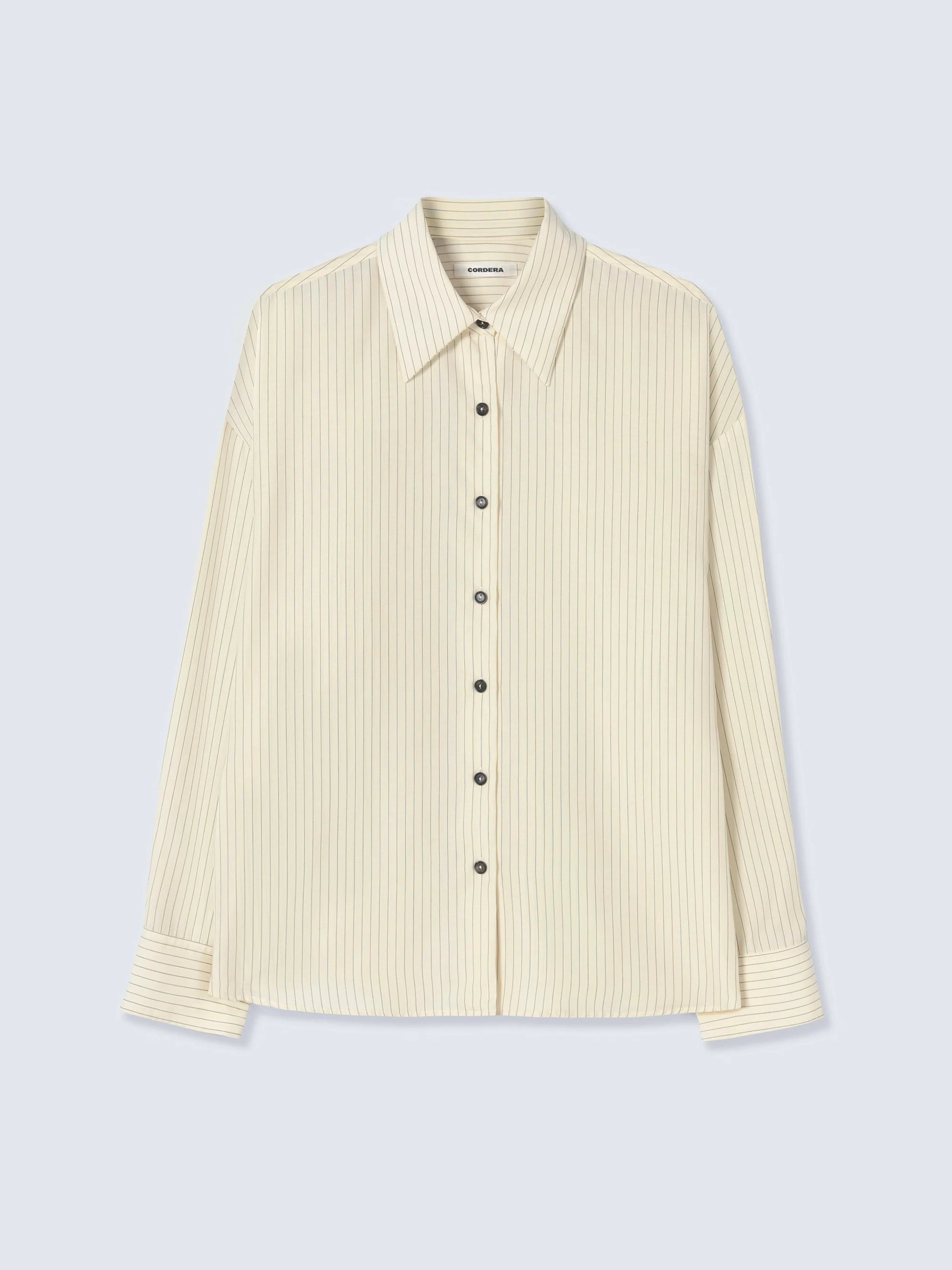 Beige ribbed shirt on a light gray background