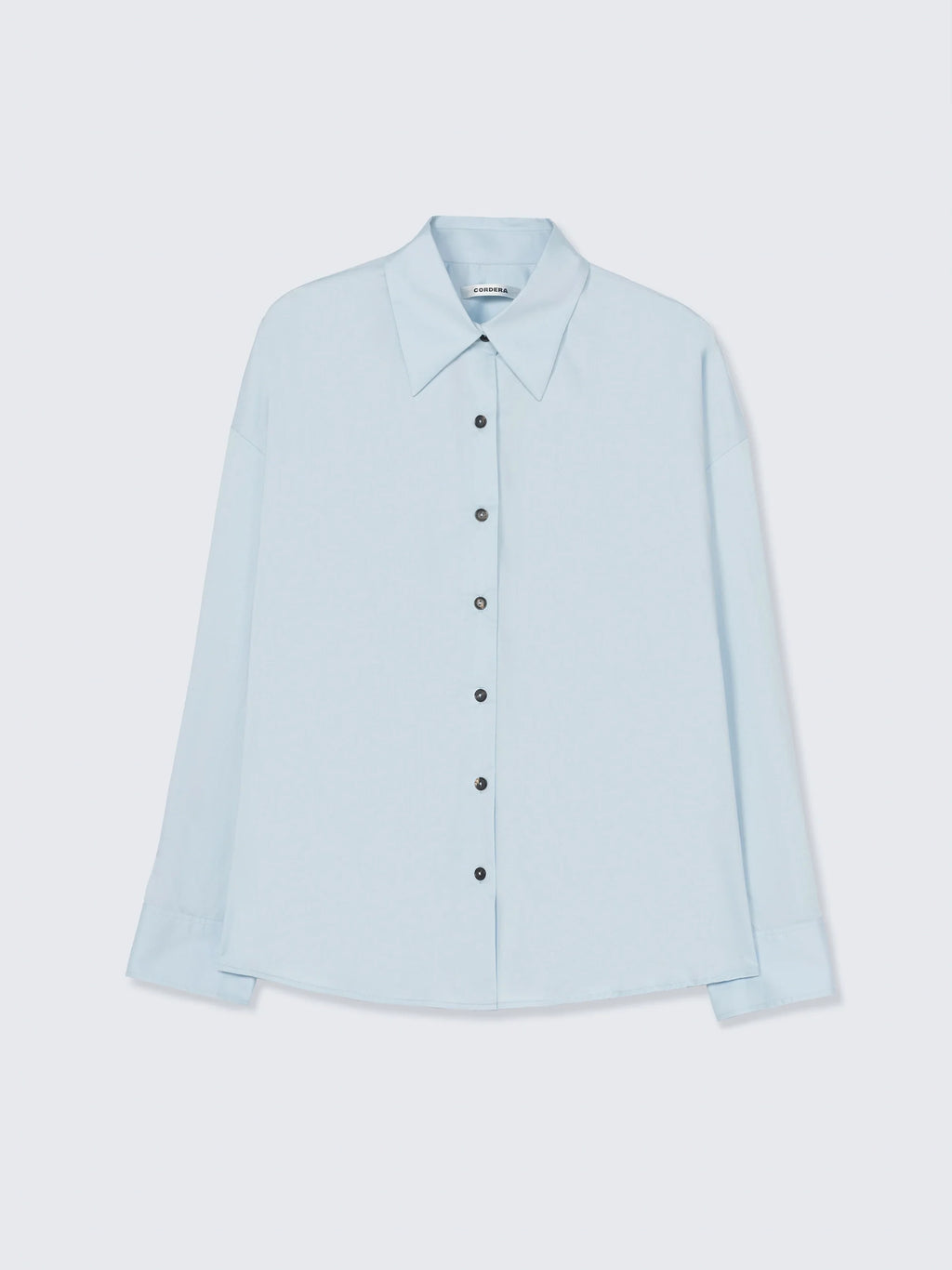 Light blue shirt on a light gray background