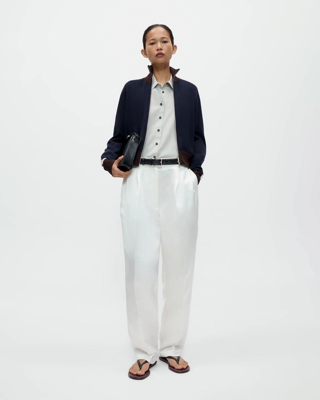 Model wearing CORDERA Satin Masculine Barrel Pants in white with an oversized barrel silhouette and sharp front crease.