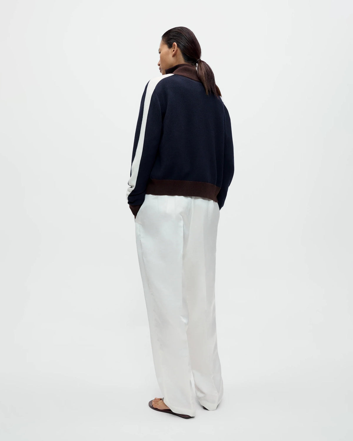 Model wearing CORDERA Satin Masculine Barrel Pants in white with an oversized barrel silhouette and sharp front crease.