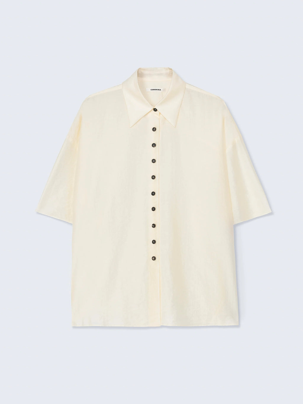 Beige short-sleeve shirt on a light gray background