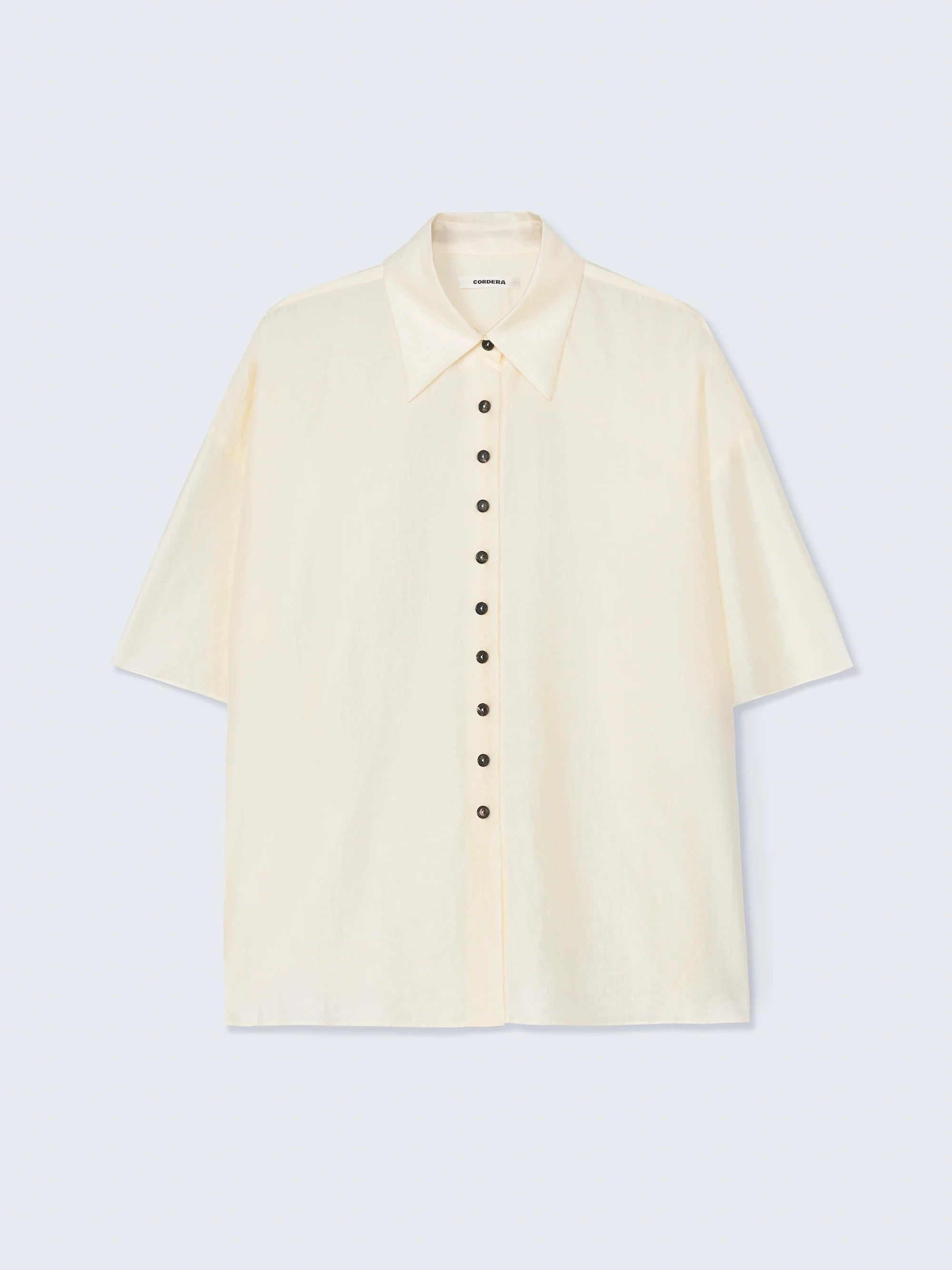 Beige short-sleeve shirt on a light gray background