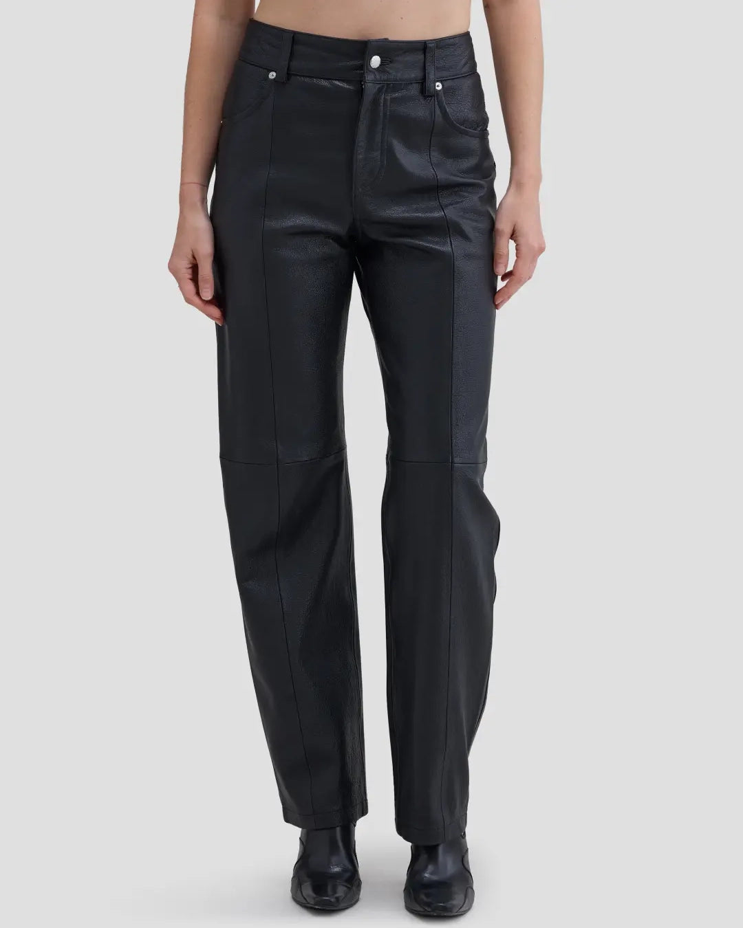 Front view of model wearing Eckhaus Latta Cruising Jean in Dusk with a high-rise straight leg in black leather.