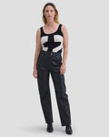 Model wearing Eckhaus Latta Cruising Jean in Dusk with a high-rise straight leg in black leather.