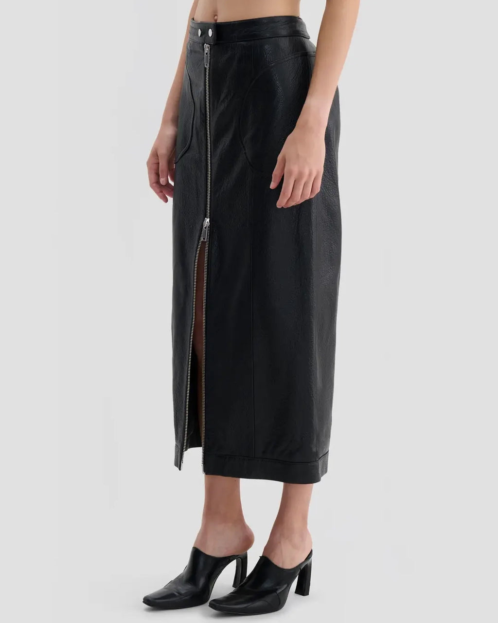 Side view of Eckhaus Latta Cruising Skirt in dusk with a high-rise, straight silhouette and center-front zip closure.