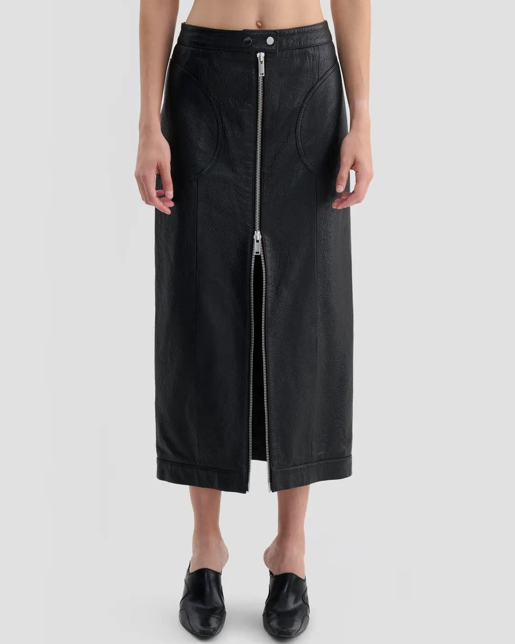 Detail view of Eckhaus Latta Cruising Skirt in dusk with a high-rise, straight silhouette and center-front zip closure.