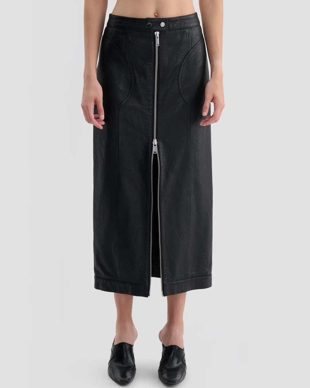 Detail view of Eckhaus Latta Cruising Skirt in dusk with a high-rise, straight silhouette and center-front zip closure.
