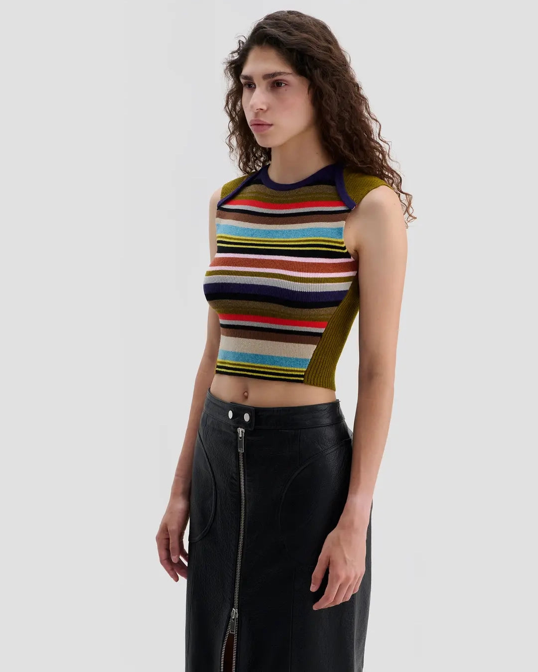 Side view of model wearing Eckhaus Latta Envelope Top in Spectrum with a fitted shape and multicolor striped front.