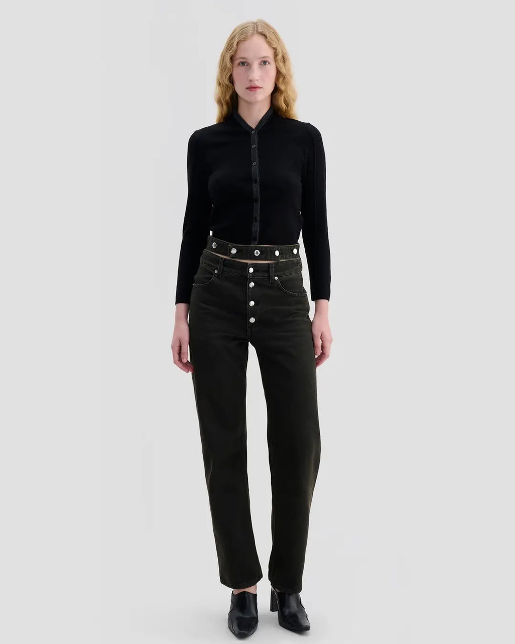 Model wearing Eckhaus Latta Racer Cardigan in black with charcoal trim and a shrunken fit.
