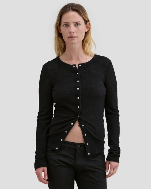 Model wearing Eckhaus Latta Scrunch Cardigan in black with a slim fit and nickel snap closures.