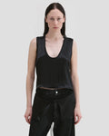 ￼￼Model wearing Eckhaus Latta Zephyr Tank in oil with a low neckline and front waist peplum.
