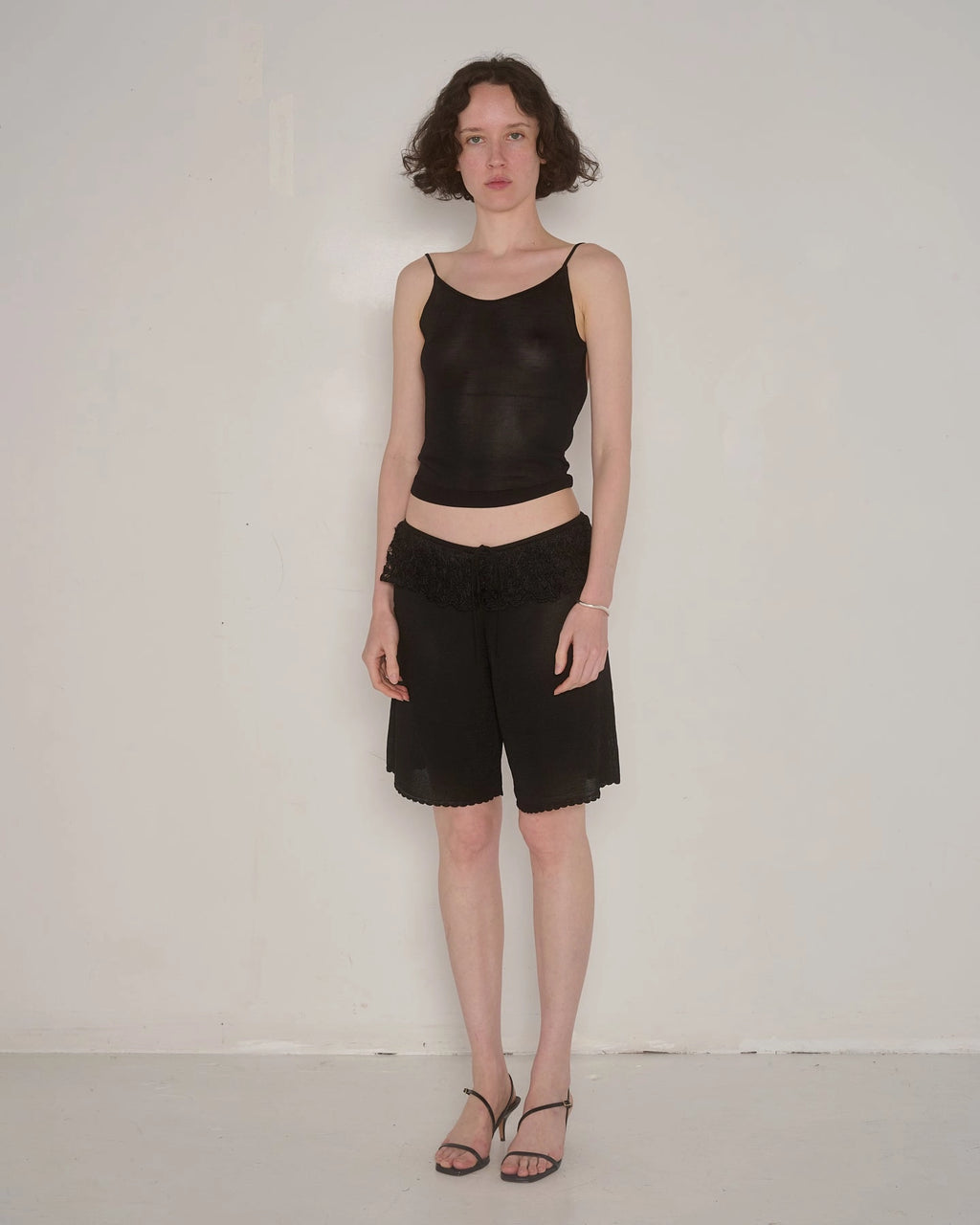 Ash Ruffle Shorts in Black by EMILY DAWN LONG