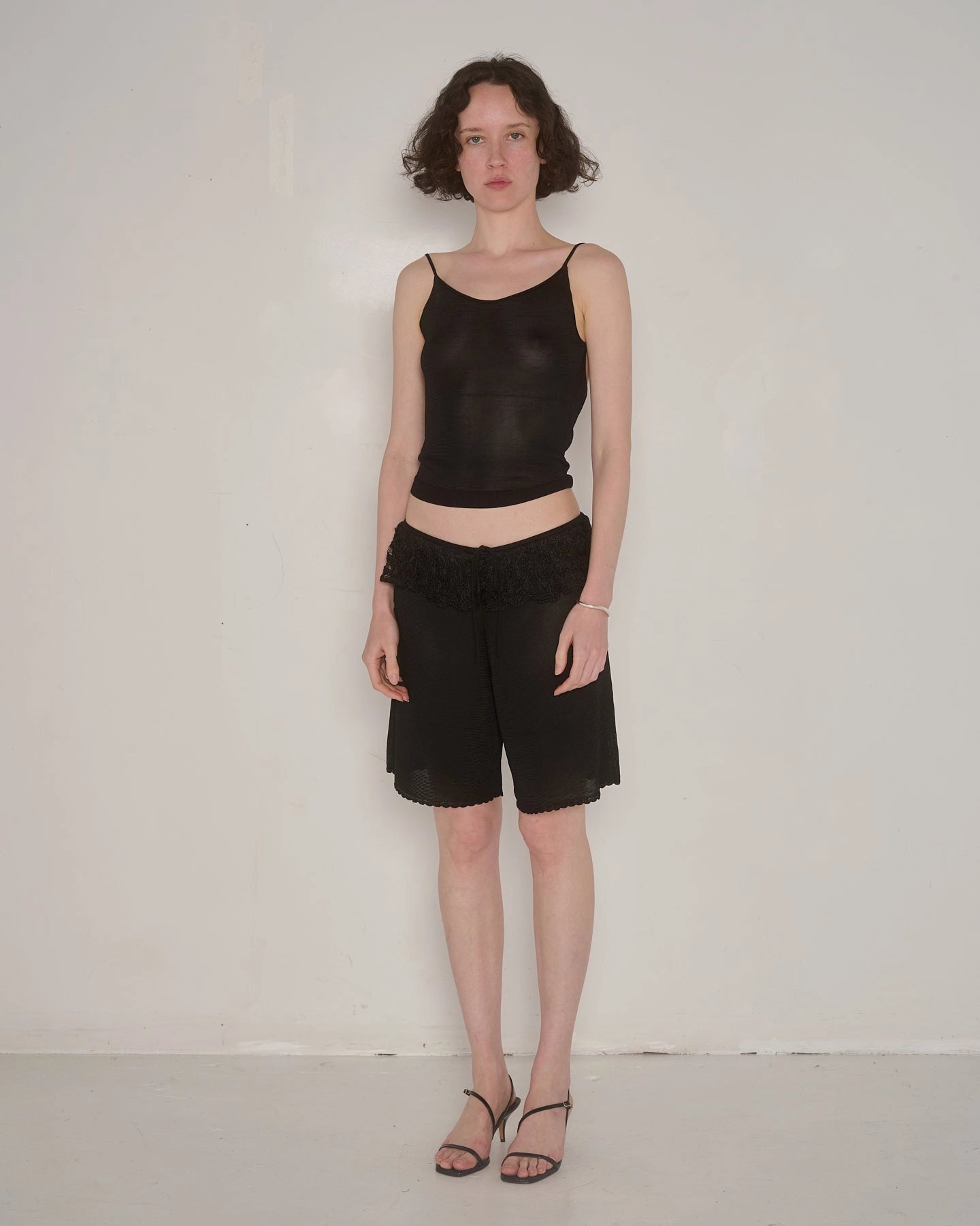 Ash Ruffle Shorts in Black by EMILY DAWN LONG