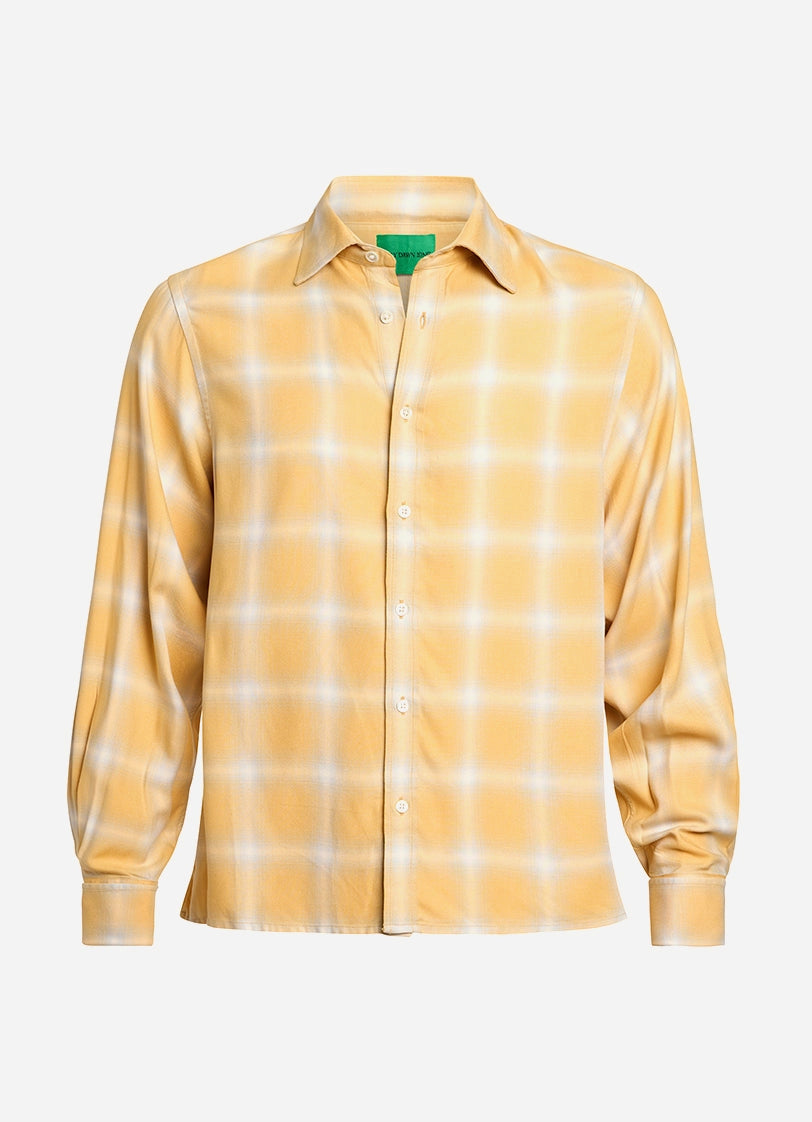 Yellow checkered shirt on a light gray background