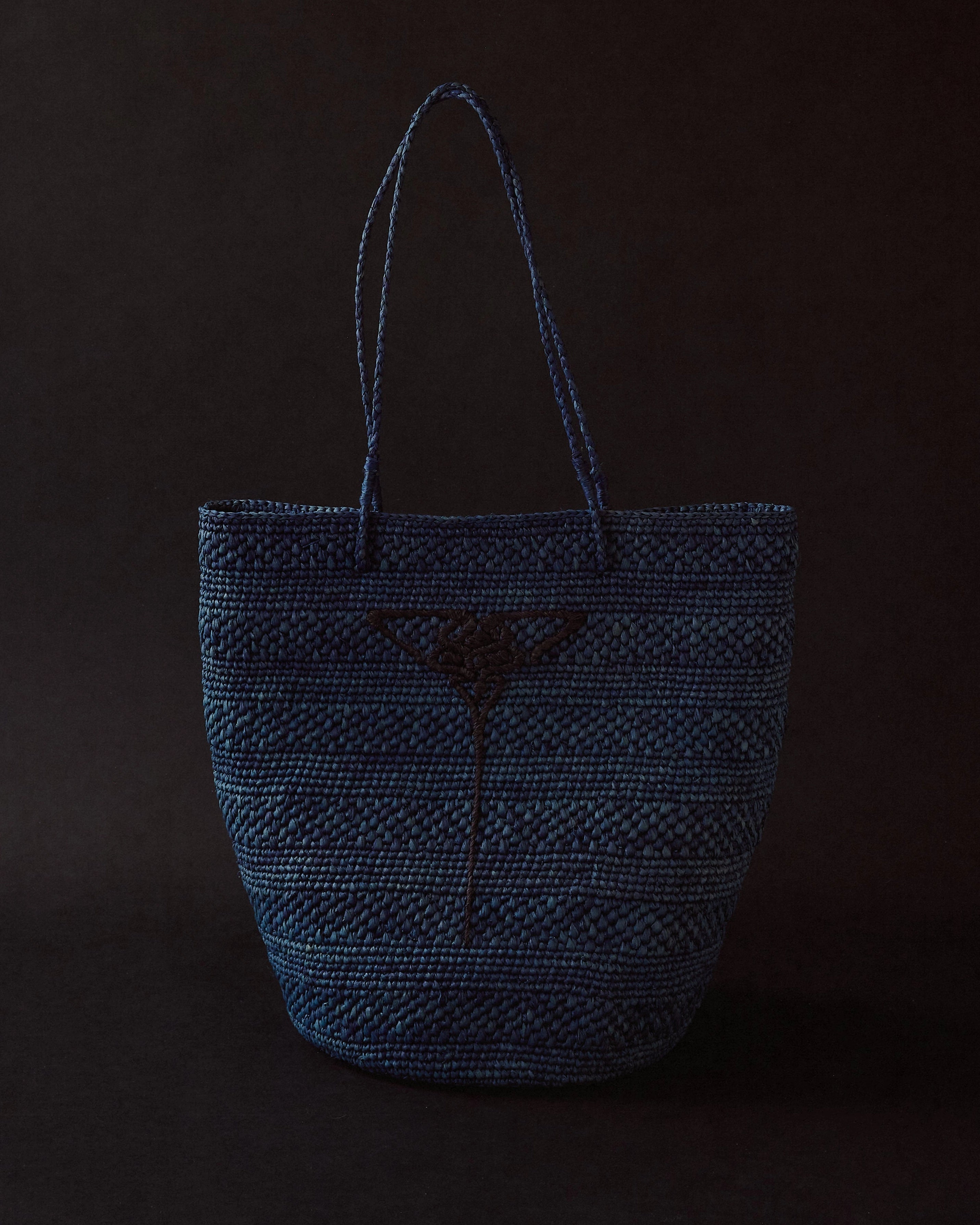 Blue hand-crocheted raffia tote by EMILY DAWN LONG with hand-embroidered Art Nouveau fan motif.